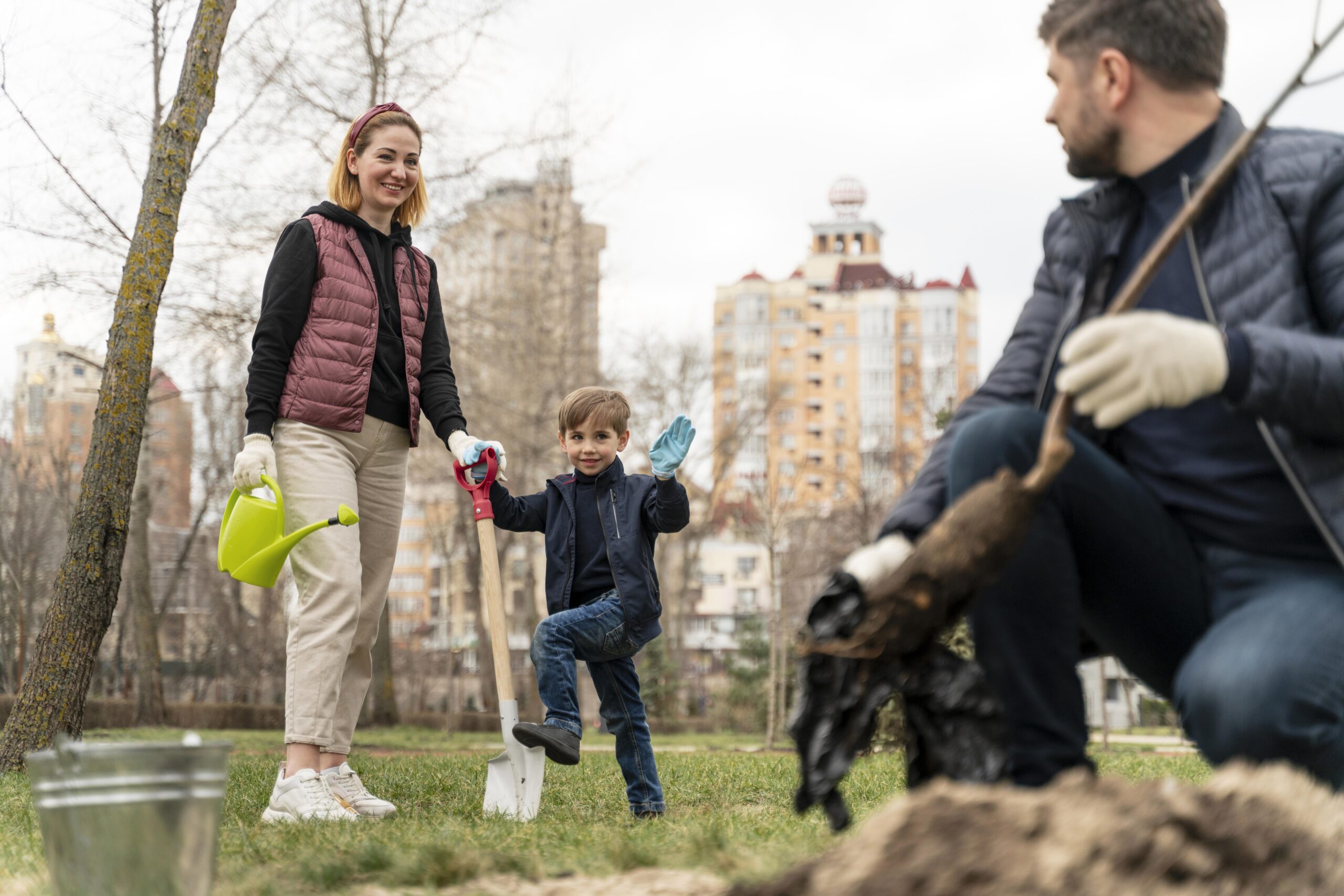family-plating-together-ground-outdoors