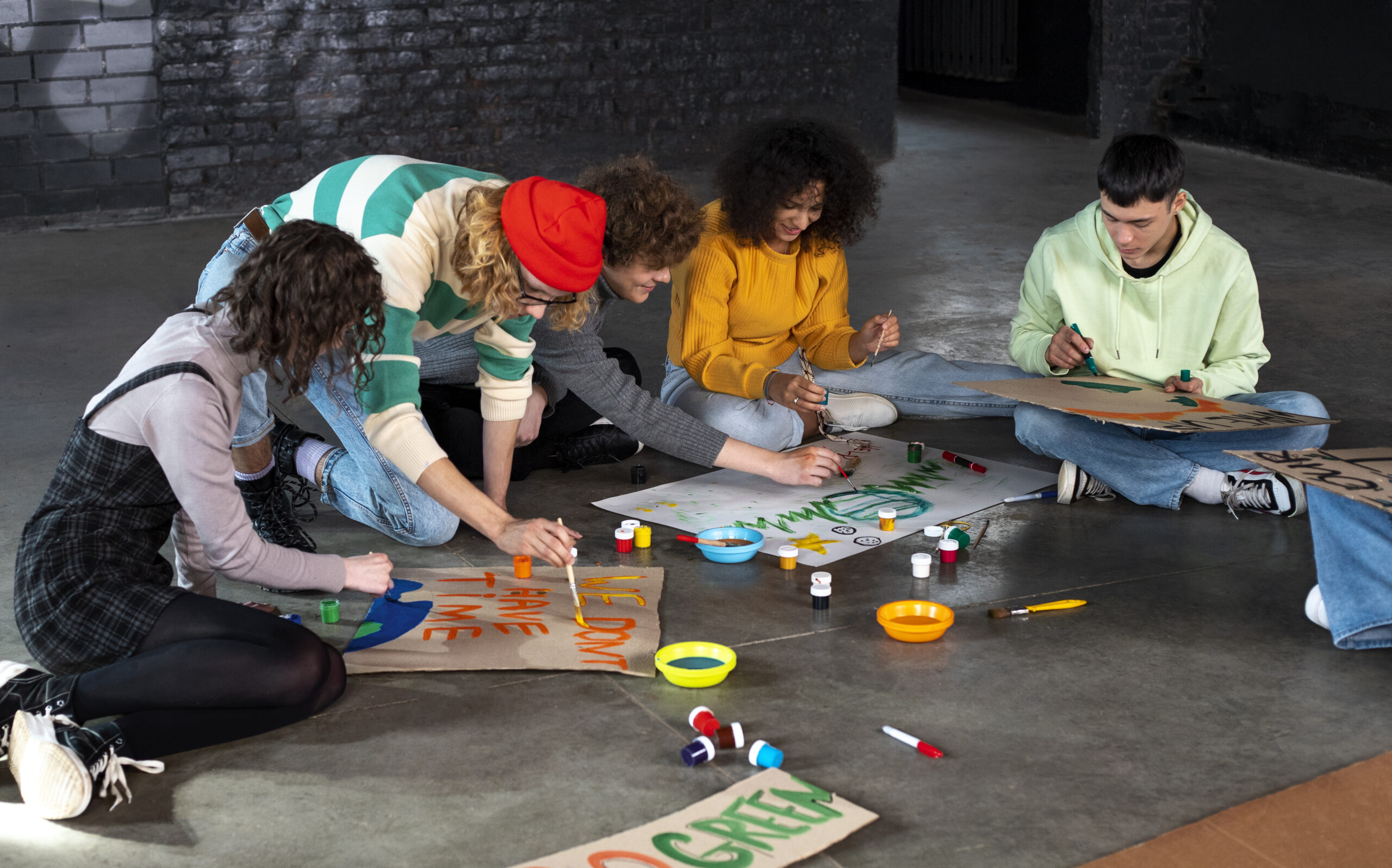 people-making-banners-full-shot